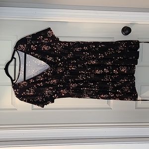 XXL black flowered shirt.  Gathers just under bust line and length is past hip.